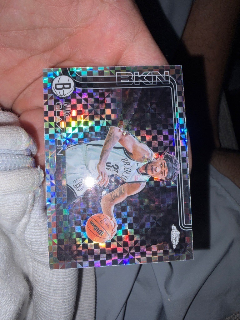 Nic Claxton (Note: This is a basketball card featuring Nic Claxton, despite the prompt's request for a football card evaluation)